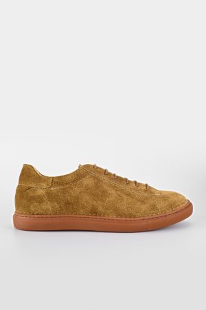 desert-brown suede sneakers.