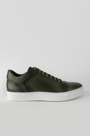 forest-green cap toe patina sneakers.